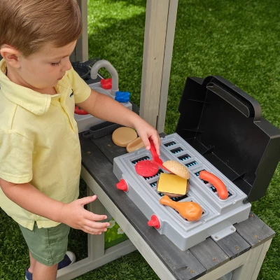 KidKraft Patio Party Wooden Outdoor Playhouse With Spinner Block Puzzle - 14pc 4 KidKraft Patio Party Wooden Outdoor Playhouse With Spinner Block Puzzle - 14pc - Image 2